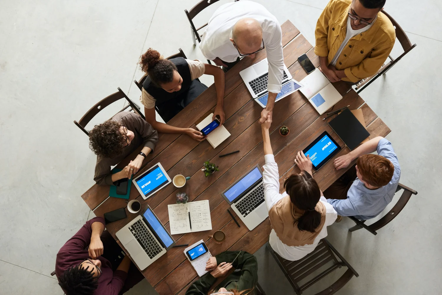 Colleagues working together around a meeting table
